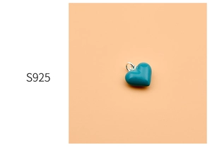 Close-up of blue enamel heart pendant in 925 sterling silver with S925 hallmark detail