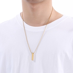 Close-up of men wearing a gold stainless steel snake chain necklace with rectangular pendant