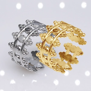 Macro shot of silver and gold crown rings with beaded details and adjustable design