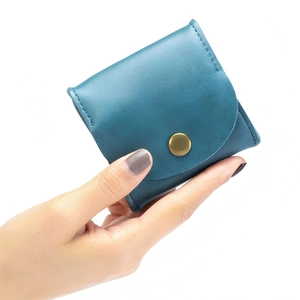 Handheld vintage teal cowhide leather mini coin purse with gold snap button closure