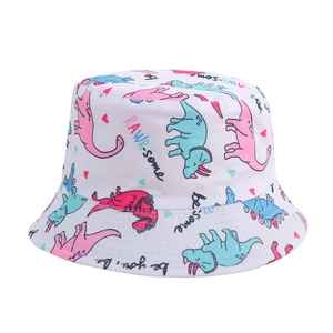 Close-up of white cotton sun hat with colorful dinosaur patterns and wide brim detail