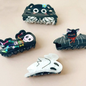 Halloween claw clip set featuring black spider, skull, ghost, and bat designs