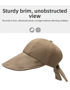 Detailed view of the khaki wide brim sun hat showing thick canvas fabric and adjustable bow tie