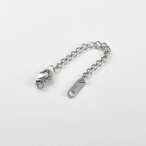 Close-up of stainless steel extension chain with lobster clasp and S.STEEL stamp detail