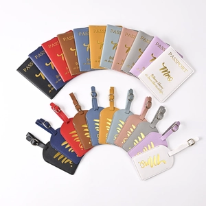 Multiple colors of PU leather passport covers and luggage tags set with gold foil lettering