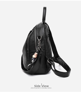 Side view of black soft leather backpack with lychee texture and silver hardware