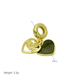 Detail of a golden heart charm with MOM cutout and a black solid heart pendant
