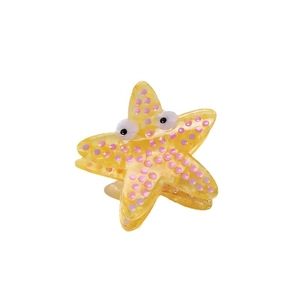 Cute yellow starfish claw clip made of acetate with pink dots for hair styling