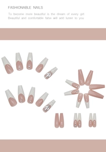 Detail of pink and white French ballerina press-on nails with rhinestones and glitter