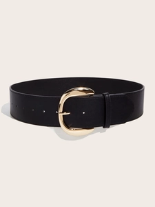 Detail of a wide black leather belt featuring a polished gold horseshoe-shaped metal buckle