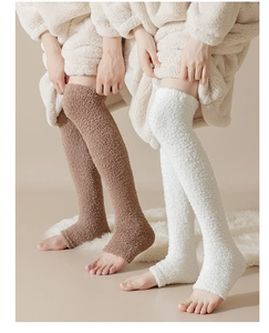 Detail of warm coral fleece long socks in brown and white for winter leg protection