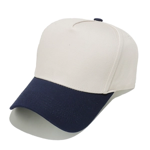 Detail of two-tone hard top baseball cap showing cream panels and navy blue visor