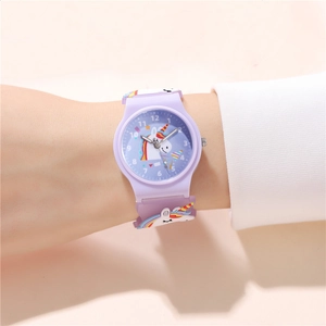 Detailed view of purple unicorn kids watch with silicone strap and numeric dial