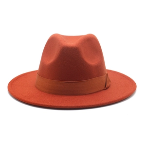 Close-up of caramel wool fedora hat featuring a matching grosgrain ribbon and side knot