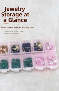 Detailed view of a 10-grid pink nail art storage box with transparent compartments for gems