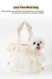 Detail of breathable lace pet carrier bag showing elegant floral embroidery and mesh