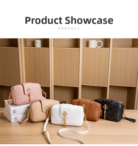 Detail view of five colors of embossed PU leather crossbody bags with crown tassels