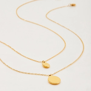 Elegant gold-tone stainless steel layered necklaces with polished round pendant charms