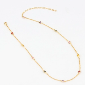 Gold chain necklace with multi-color cubic zirconia stones on white background
