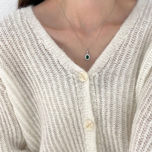 925 silver necklace with oval emerald green zircon pendant shown on model neck