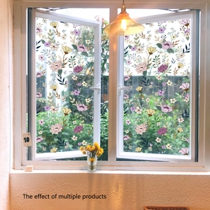 Floral static cling window film with purple flowers and green leaves on white window pane