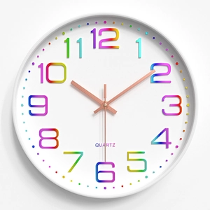 Detail of 3D rainbow Arabic numerals and rose gold hands on 30cm white wall clock