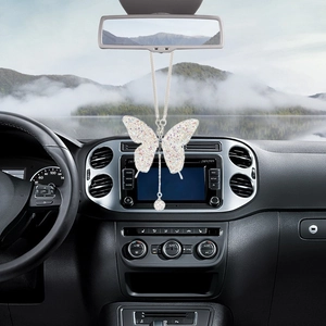 Diamond butterfly car pendant hanging from rearview mirror with sparkling crystal details