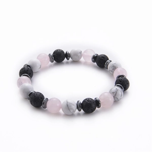 Macro detail of 8mm lava stone and rose quartz beads on elastic yoga bracelet