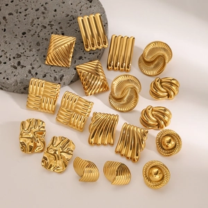 Golden geometric earrings set including striped rectangular and spiral disc designs