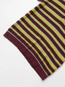 Detailed macro shot of the premium striped knit fabric texture and high-quality hem stitching