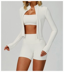 Detail of ribbed texture on white stand collar zipper yoga jacket with slim fit design