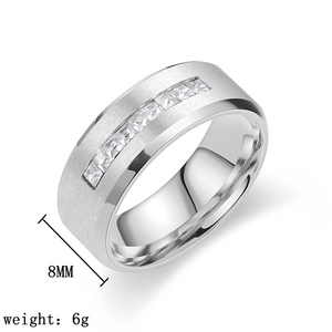 Detail shot of a 8mm titanium steel ring with micro-set zircon and brushed finish