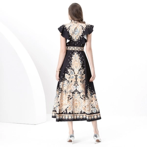 Vintage floral paisley print maxi dress with ruffles and cinched waist in back view