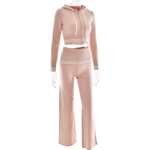 Detailed knit texture of pink two-piece set with white stripe hem and cuff accents