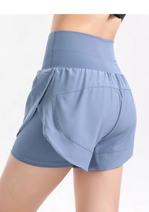 Detail of high-waisted fog blue double-layer fitness shorts with side split design