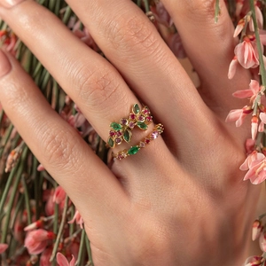 Detail shot of two S925 silver rings with colorful marquise zircons and leaf design