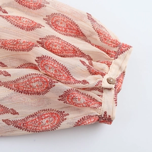 Women's vintage chiffon blouse featuring paisley print and metallic stripe cuffs