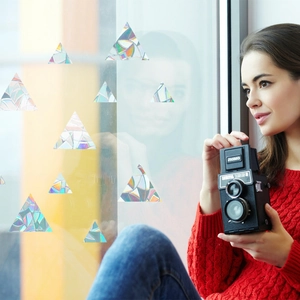 Rainbow prism triangle window film with holographic reflection on glass window