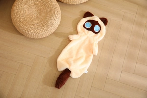 Detailed close-up of a long Siamese cat plush shell on a warm wooden floor