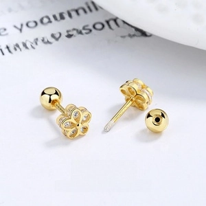 Detailed macro view of golden tulip flower stud earrings with sparkling zircon crystals