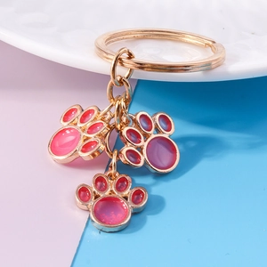 Cute pink cat paw keychain with gold metal ring and enamel pendant for backpacks