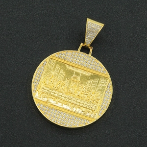 Detailed macro of gold plated Last Supper pendant with shimmering crystal rhinestones
