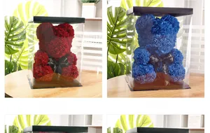 Close-up of red and blue PE foam rose bears in transparent gift box with silk ribbon