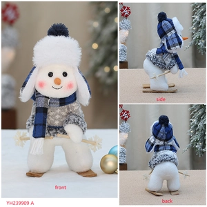 Detailed views of a blue knitted Christmas snowman ornament from front, side and back angles