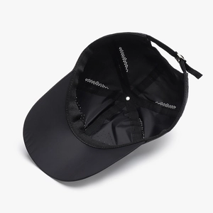 Quick-dry black baseball cap showing breathable laser-cut holes and inner lining