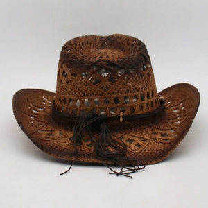 Detailed view of the hollow-out pattern and decorative cord on a brown straw cowboy hat