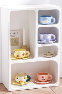 Creative hand-painted ceramic cup and saucer set featuring cute floral and bear patterns