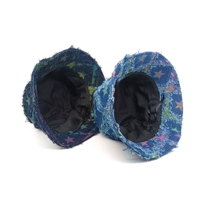 Denim star-patterned bucket hats with distressed frayed edges and internal adjustable straps