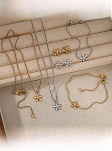 Detail of flower jewelry set with matte finish and crystals in a velvet gift box