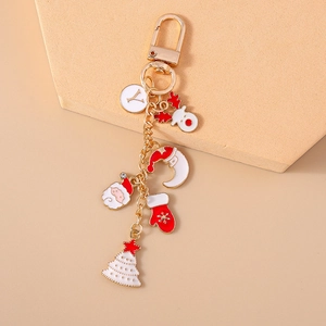 Detailed view of Christmas keychain charms featuring Santa, reindeer, and festive tree
